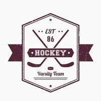 emblème vintage de hockey, logo avec bâtons croisés, les textures grunge peuvent être supprimées vecteur