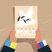 paix entre la russie et l'ukraine. les mains tiennent une feuille avec l'image d'une colombe de la paix. image vectorielle. vecteur