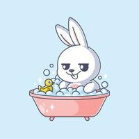 lapin mignon dans une baignoire avec canard en caoutchouc