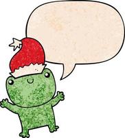 grenouille de dessin animé mignon portant un chapeau de noël et une bulle de dialogue dans un style de texture rétro vecteur