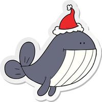 caricature d'autocollant d'une baleine portant un bonnet de noel vecteur