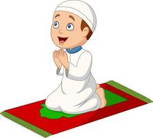 dessin animé garçon musulman priant sur le tapis de prière vecteur