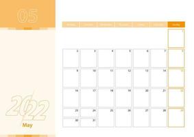 planificateur horizontal pour mai 2022 dans la palette de couleurs orange. la semaine commence le lundi. vecteur