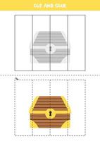 jeu de découpe et de collage pour les enfants. coffre au trésor de dessin animé. vecteur