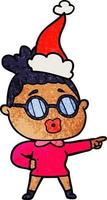 dessin animé texturé d'une femme pointant portant des lunettes portant un bonnet de noel vecteur