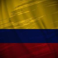 vecteur de fond de drapeau colombie ondulé avec style de trait de pinceau. illustration vectorielle de la fête de l'indépendance de la colombie.