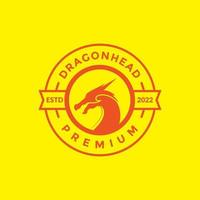insigne avec tête de dragon côté logo design vecteur symbole graphique icône illustration idée créative