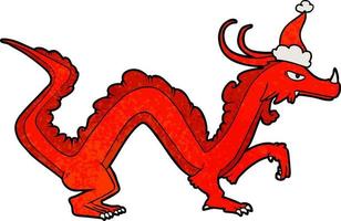 dessin animé texturé d'un dragon portant un bonnet de noel vecteur