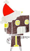 dessin animé rétro d'un robot portant un bonnet de noel vecteur