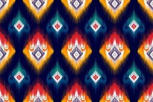 conception de modèle ethnique sans couture ikat. tapis en tissu aztèque ornements de mandala décorations textiles papier peint. tribal boho natif ethnique turquie broderie traditionnelle vecteur fond