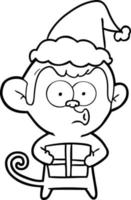 dessin au trait d'un singe de noël portant un bonnet de noel vecteur