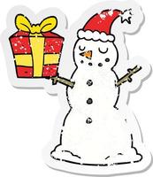 autocollant en détresse d'un bonhomme de neige dessin animé avec cadeau vecteur