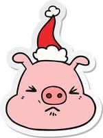 caricature d'autocollant d'un visage de cochon en colère portant un bonnet de noel vecteur