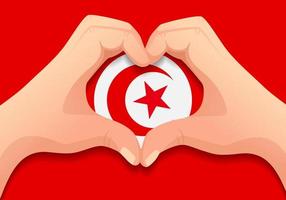 drapeau tunisien et forme de coeur à la main vecteur