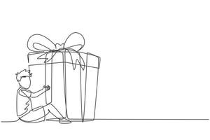 une ligne continue dessinant un petit garçon heureux assis et étreignant une énorme boîte-cadeau avec un arc de ruban enroulé devant ses bras. les enfants acceptent un cadeau d'anniversaire ou un cadeau. vecteur de conception de dessin à une seule ligne