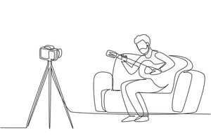 une seule ligne dessinant un homme arabe enregistrant une vidéo de sa guitare jouant par caméra sur trépied. influenceur vlogger masculin jouant de la musique pour le spectacle en streaming numérique. vecteur de conception de dessin en ligne continue