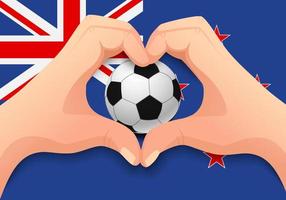 ballon de football de nouvelle-zélande et forme de coeur de main vecteur