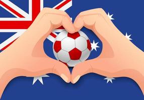 ballon de football australien et forme de coeur à la main vecteur