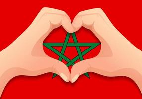 drapeau marocain et forme de coeur à la main vecteur