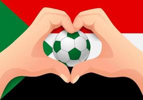 ballon de football du soudan et forme de coeur à la main vecteur