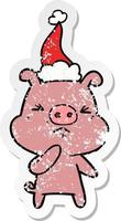 dessin animé autocollant en détresse d'un cochon en colère portant un bonnet de noel vecteur