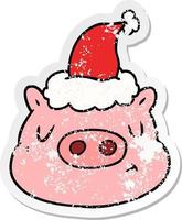 dessin animé autocollant en détresse d'un visage de cochon portant un bonnet de noel vecteur