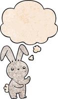 lapin de dessin animé mignon et bulle de pensée dans le style de motif de texture grunge vecteur