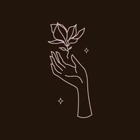 main féminine avec fleur de magnolia, illustration vectorielle de logo modèle dans le style d'art en ligne. symboles féminins pour les cosmétiques de soins de la peau à la mode vecteur