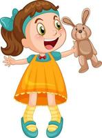 petite fille mignonne tenant une poupée de lapin vecteur