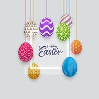 Bannière de Pâques Joyeux avec des œufs à motifs suspendus vecteur
