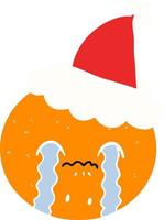 illustration en couleur plate d'une orange portant un bonnet de noel vecteur