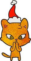 joli dessin animé texturé d'un chat portant un bonnet de noel vecteur