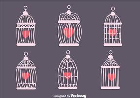 Cage d'oiseaux vintage avec des vecteurs en forme de coeur vecteur