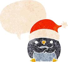 pingouin de dessin animé mignon portant un chapeau de noël et une bulle de dialogue dans un style texturé rétro vecteur