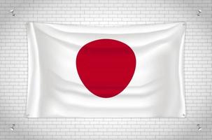 drapeau du japon accroché au mur de briques. dessin 3d. drapeau accroché au mur. dessiner soigneusement en groupes sur des calques séparés pour une édition facile. vecteur