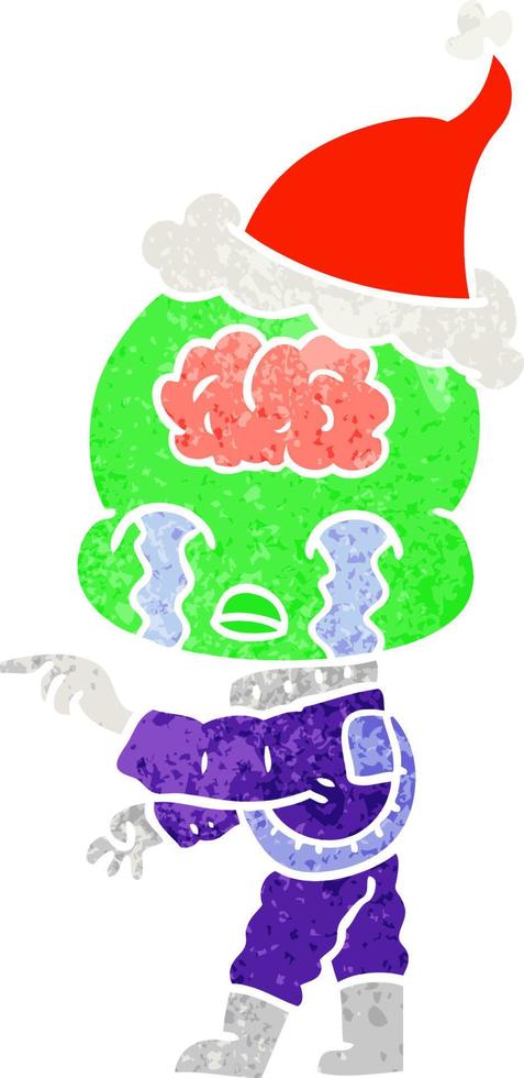 desenho retrô de um alienígena de cérebro grande chorando e apontando usando chapéu de papai noel vetor