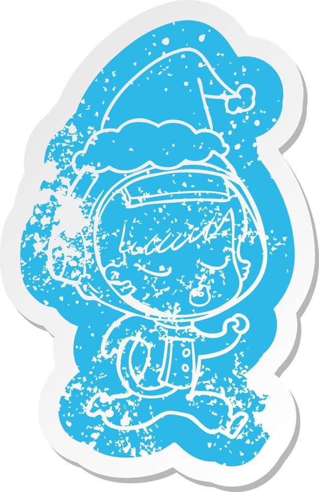 adesivo angustiado de desenho animado de uma linda garota astronauta correndo usando chapéu de papai noel vetor
