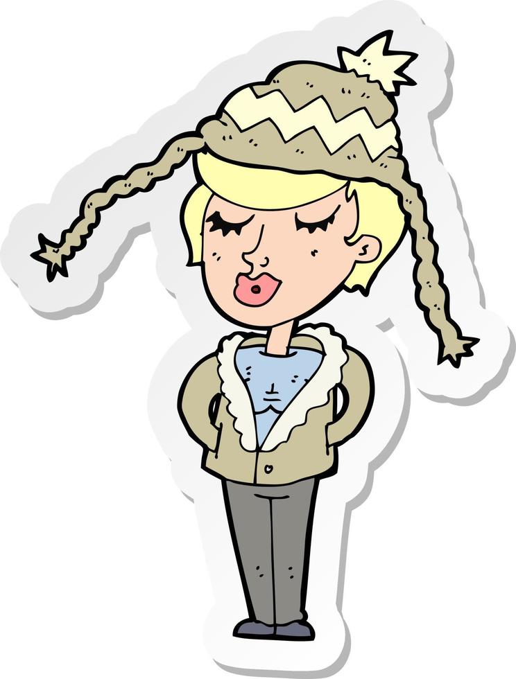 adesivo de uma mulher de desenho animado usando chapéu de inverno vetor