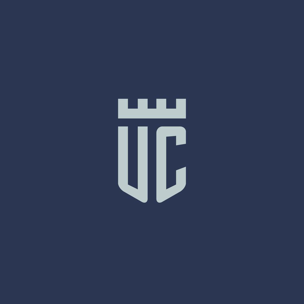 monograma do logotipo uc com castelo fortaleza e design de estilo escudo vetor