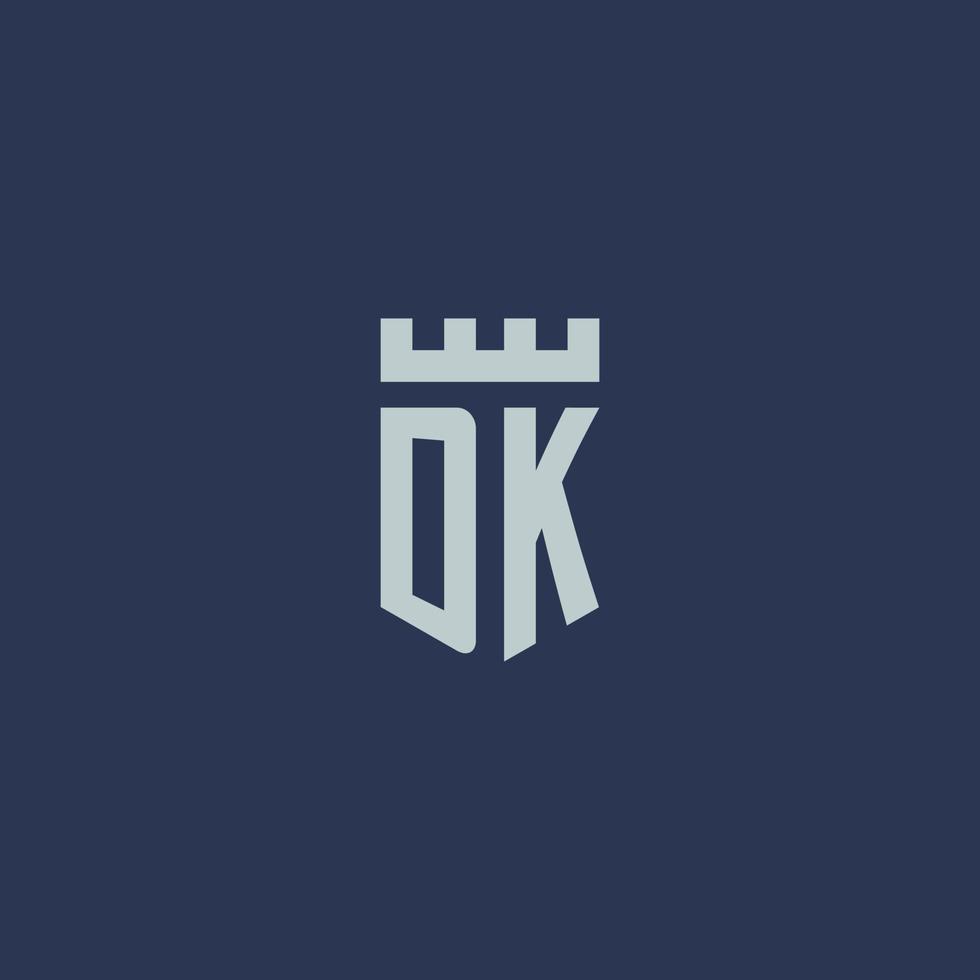 dk logotipo monograma com castelo fortaleza e design de estilo escudo vetor