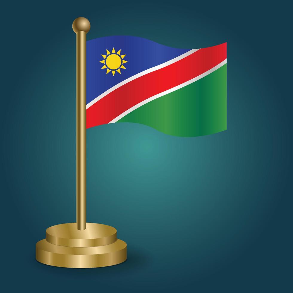 bandeira nacional da namíbia no poste dourado em fundo escuro de gradação isolado. bandeira de mesa, ilustração vetorial vetor