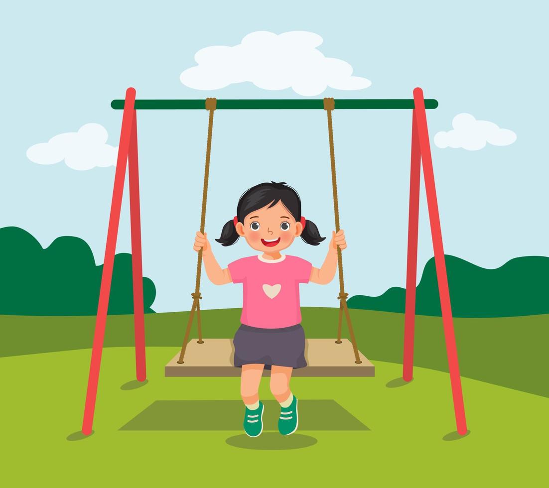 menina bonitinha balançando e se divertindo no balanço de madeira de corda no playground vetor