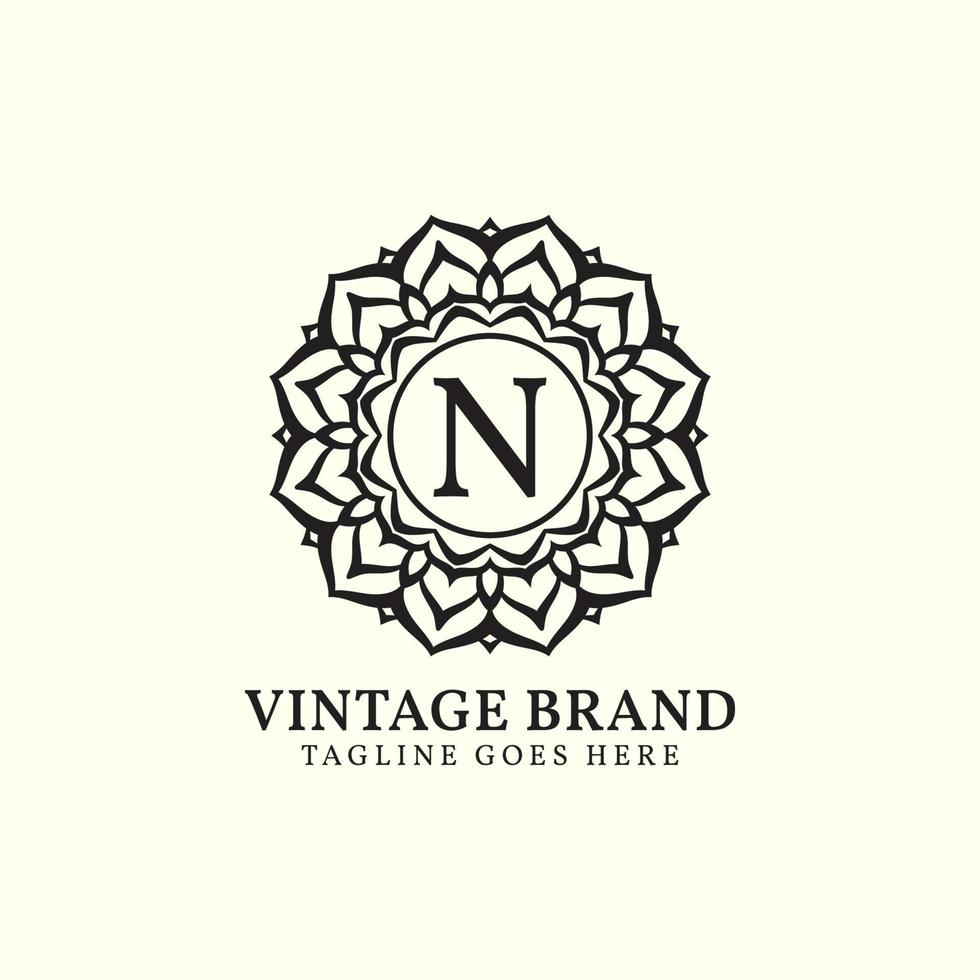 design de logotipo de vetor de letra n vintage de mandala de luxo