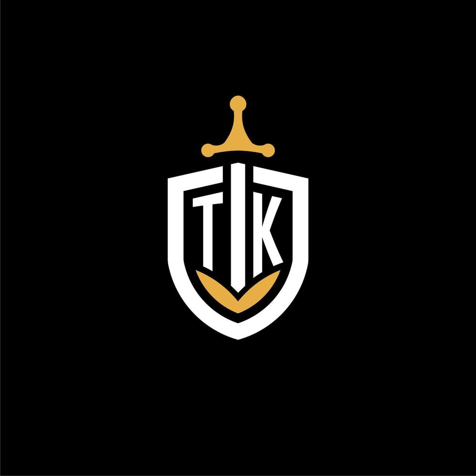 carta criativa tk logo gaming esport com ideias de design de escudo e espada vetor