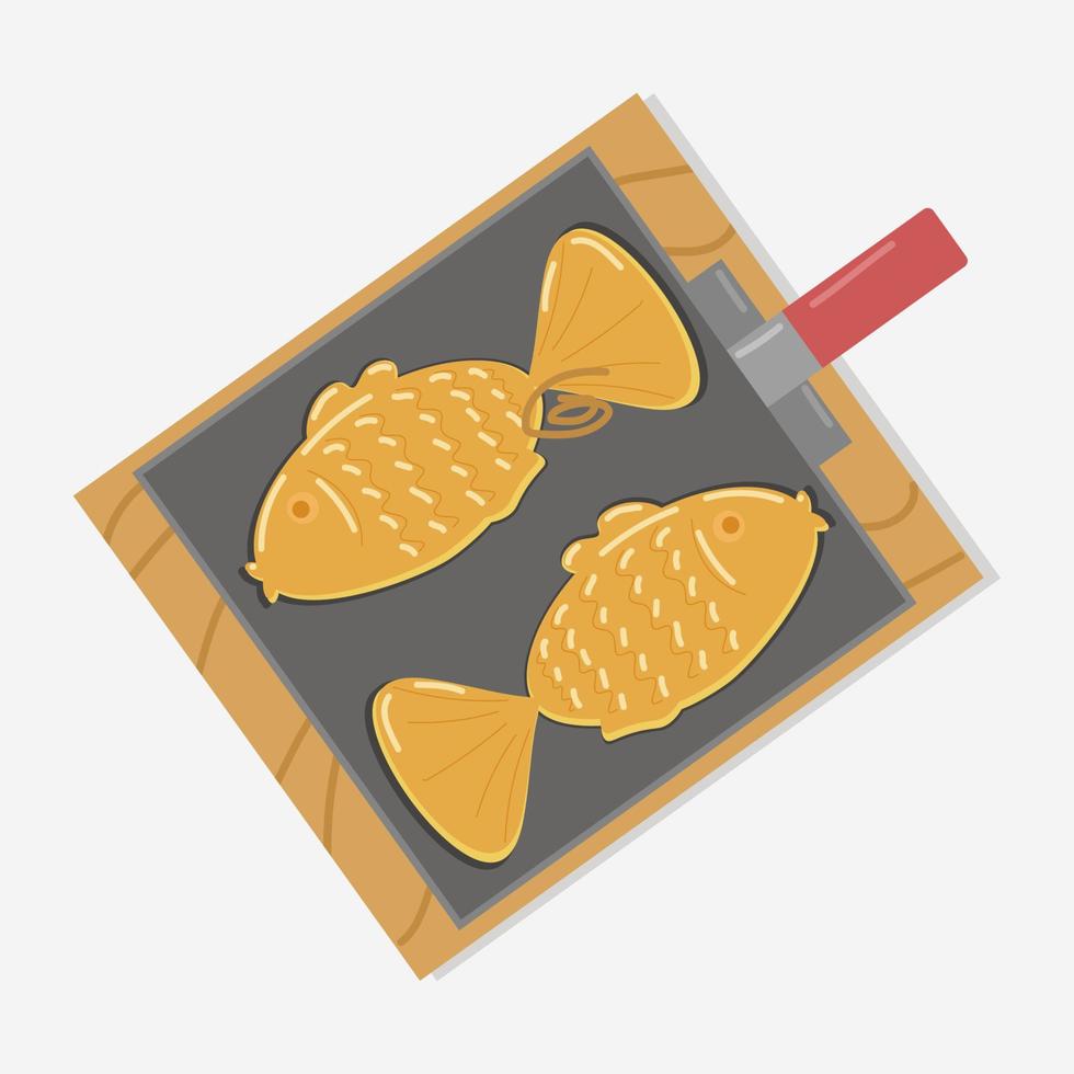 tortas em forma de peixe com pasta de feijão vermelho em uma assadeira em uma placa de madeira vetor