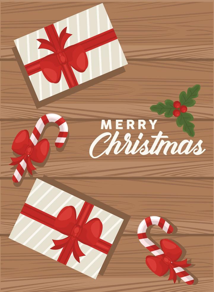 letras de feliz natal com presentes e bengalas em fundo de madeira vetor