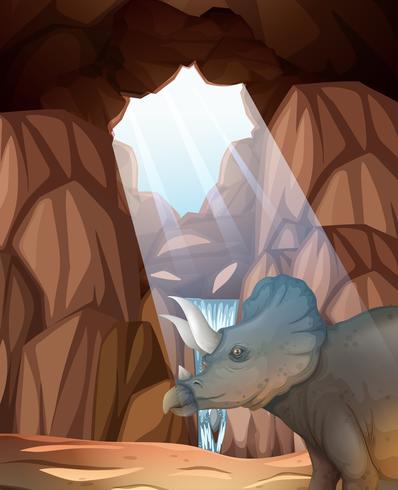 Triceratops vivendo na caverna vetor