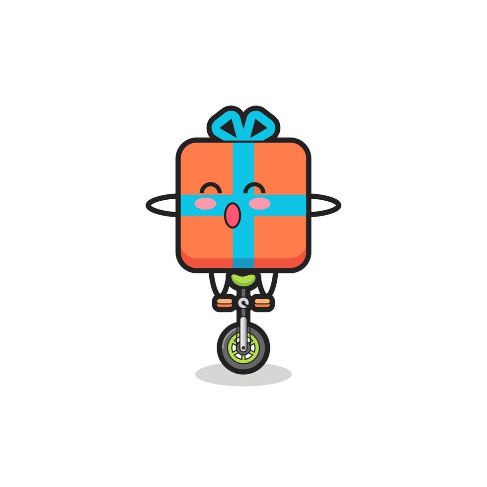 o personagem bonito da caixa de presente está andando de bicicleta de circo vetor