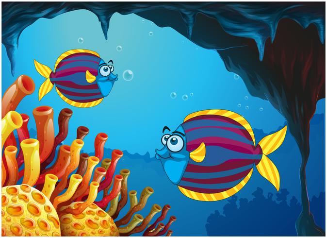 Dois peixes coloridos dentro da caverna sob o mar vetor