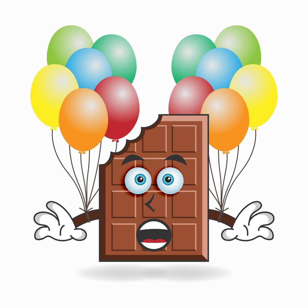personagem de mascote de chocolate segurando um balão. ilustração vetorial vetor